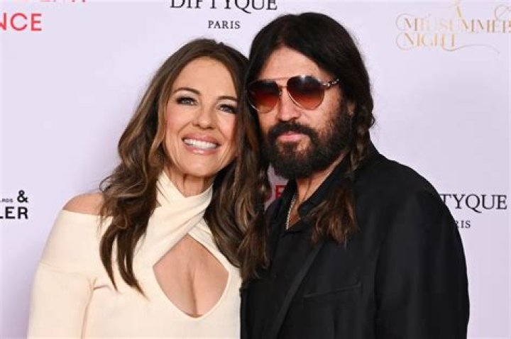 Elizabeth Hurley, 54, Transforms Into A Sexy Ninja & Strikes A Bunch Of Fierce Poses