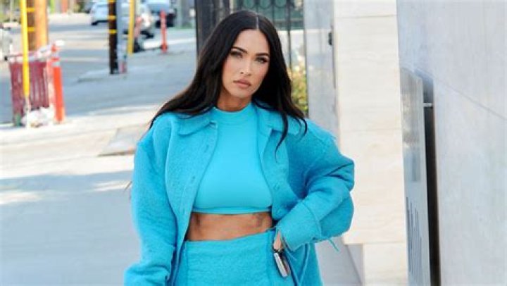 Megan Fox Stuns In Blue Crop Top, Jacket & Matching Skirt In Gorgeous New Photos