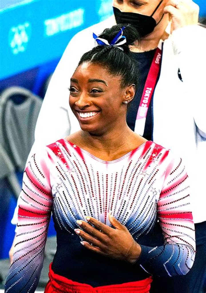 Simone Biles Wraps Her Arms Around BF Jonathan Owens As They Reunite At His NFL Practice — Photo